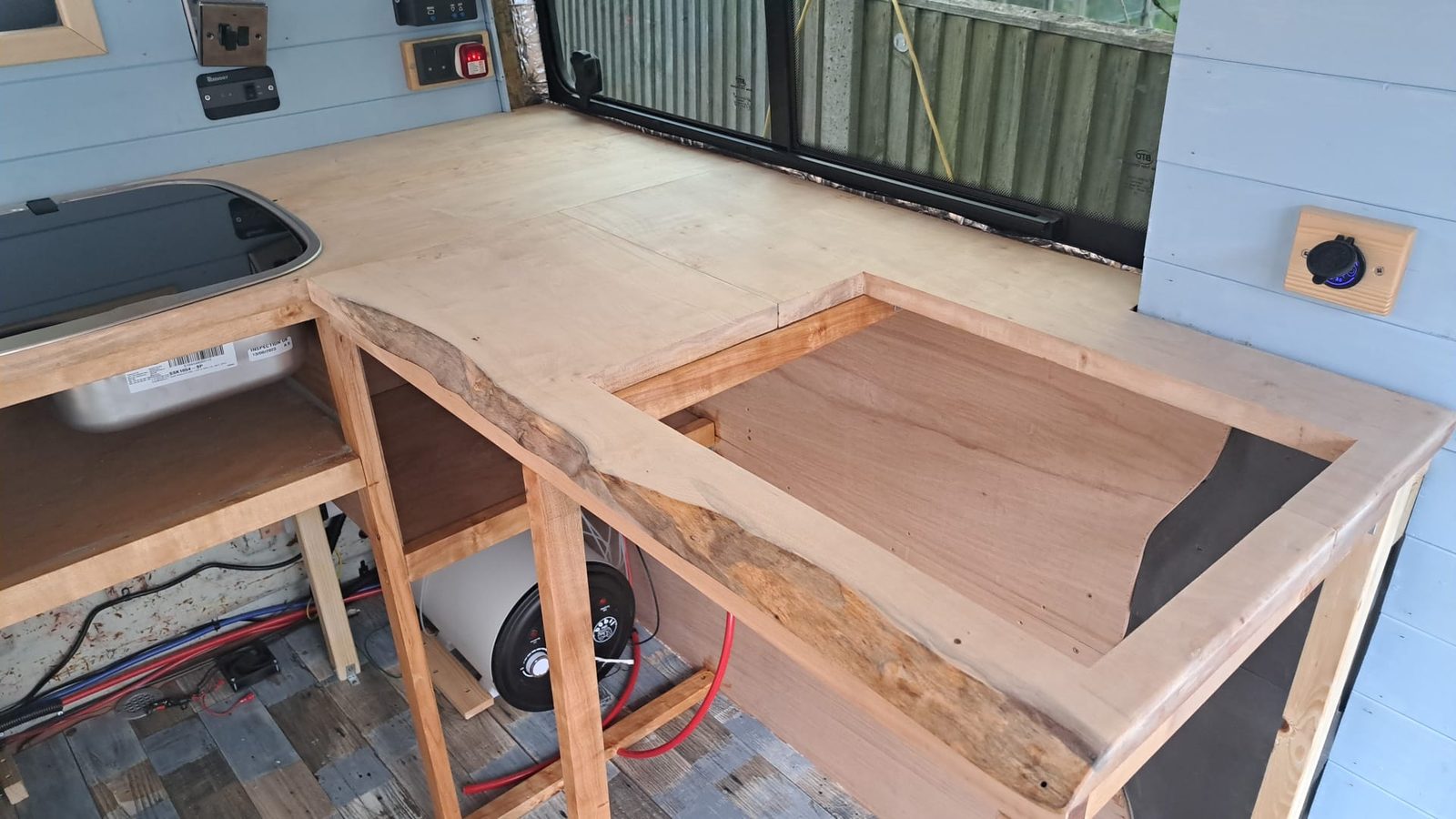Birchwood worktop being built inside a campervan