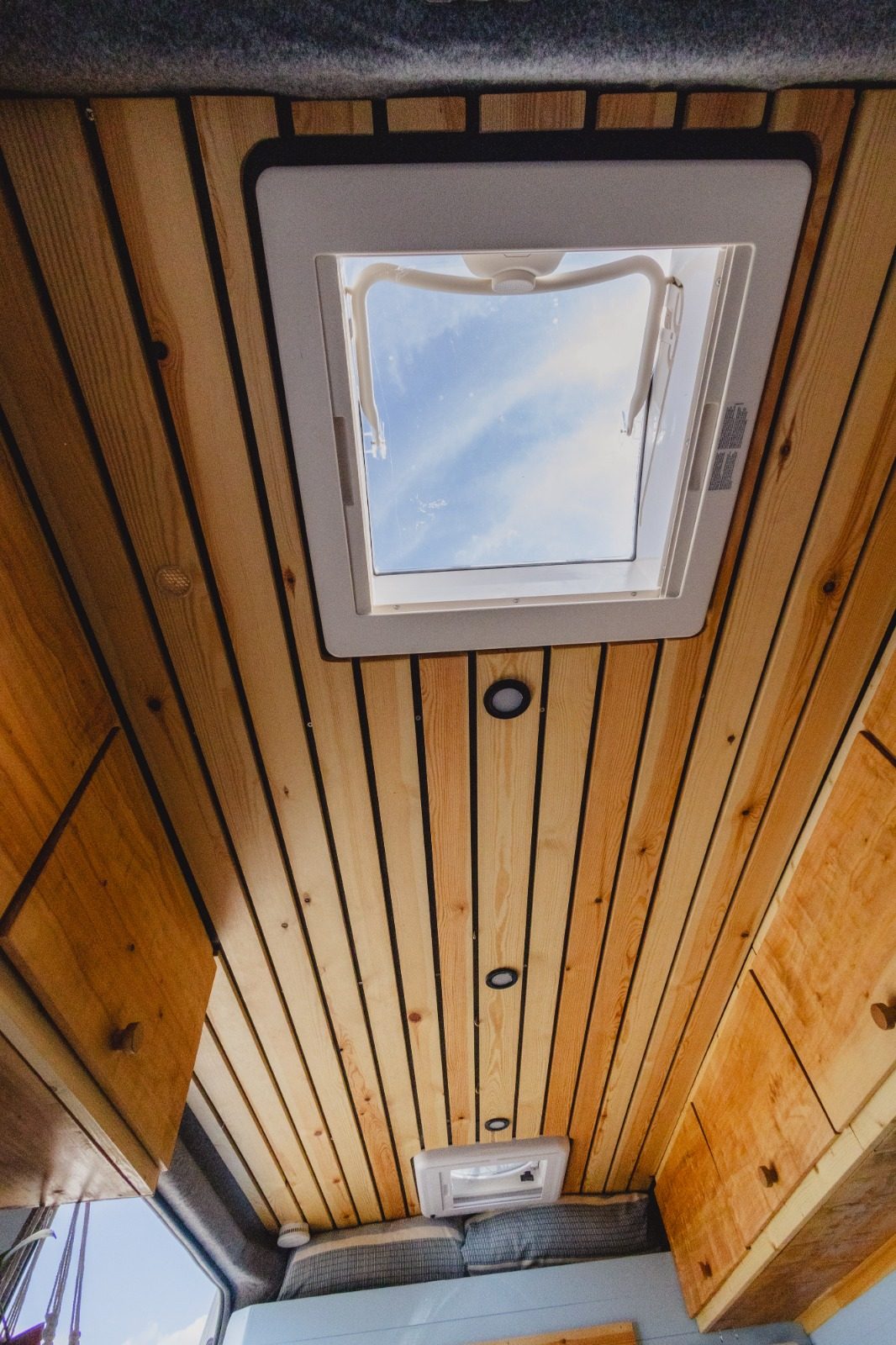 Slatted spruce campervan ceiling with skylight