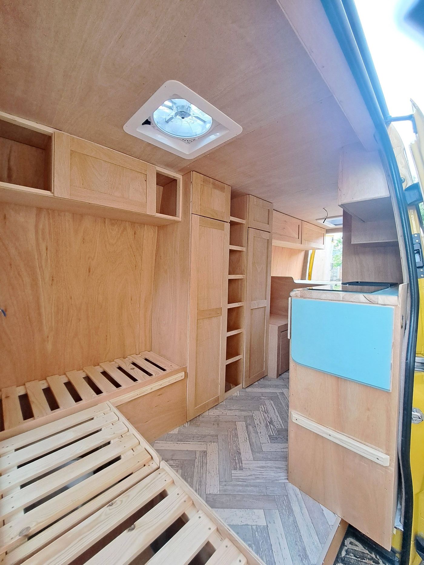 Mercedes Sprinter L3H2 campervan with birch ply interior carpentry and herringbone floor by JW Camper Carpentry