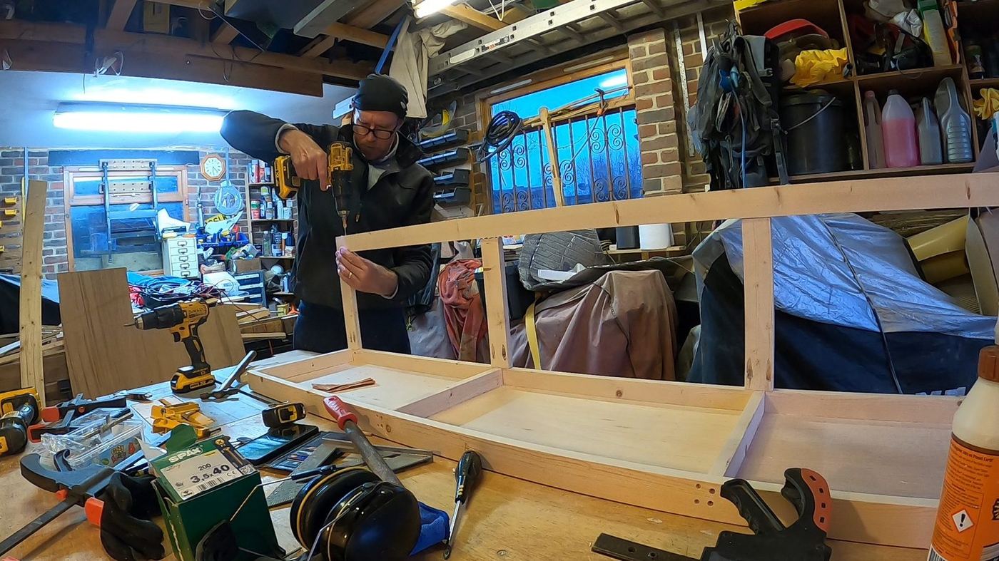 Long timber frame assembly in the workshop